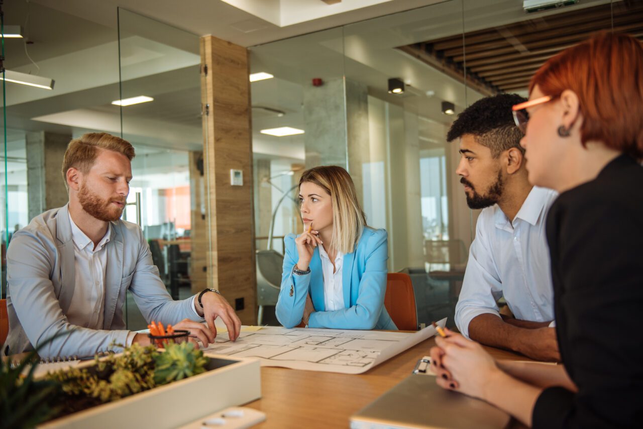 Team of business people discussing changes in the office